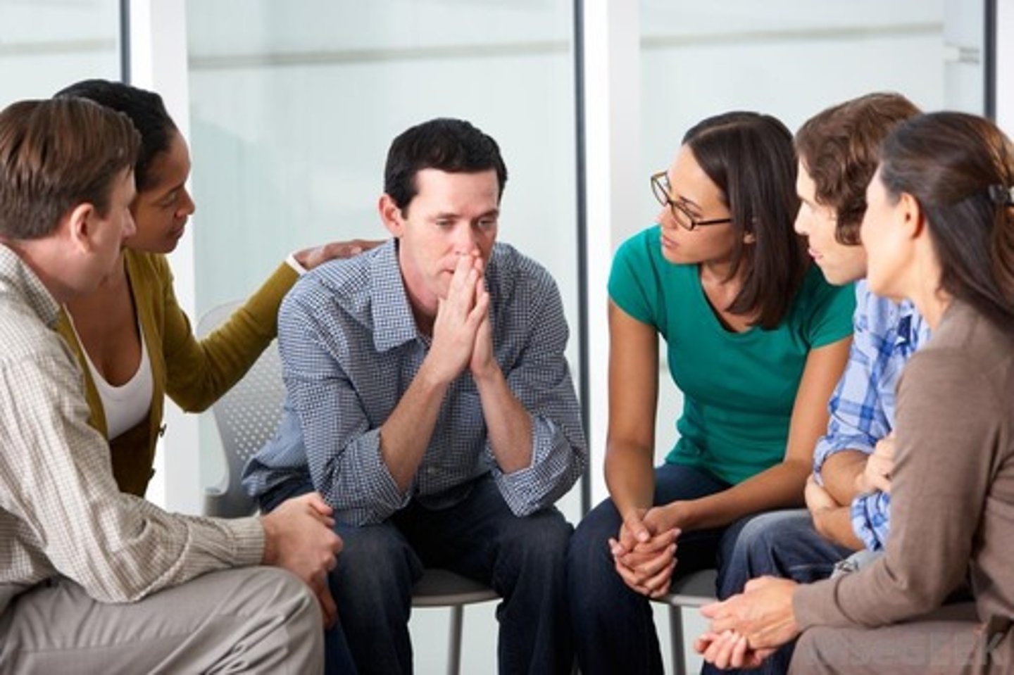 <p>therapy conducted with groups rather than individuals, permitting therapeutic benefits from group interaction</p>