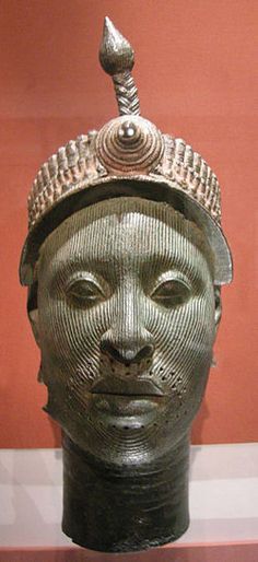 <p>A carved wooden sculpture representing the head of a Yoruba king, often used in rituals and as a symbol of authority and lineage. </p>