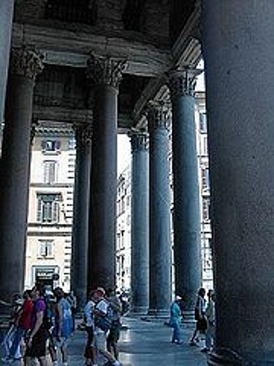 <p>A porch like structure with a roof supported by columns </p>