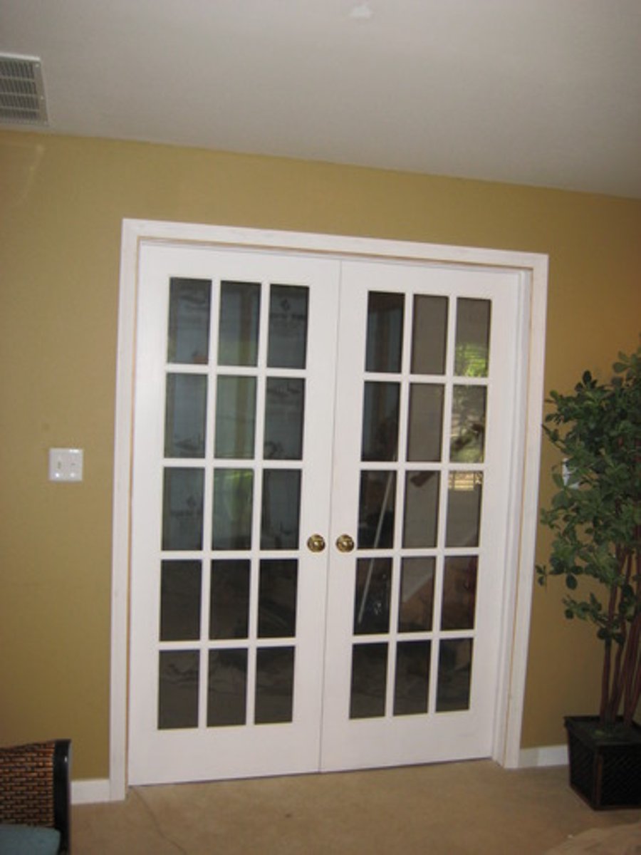 <p>door having rectangular glass panes extending throughout its length often hung in pairs</p>