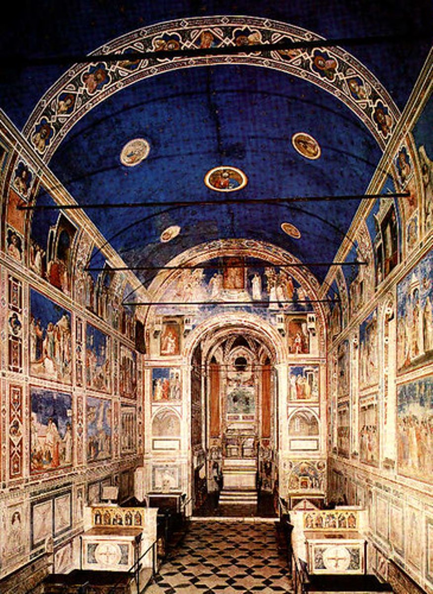 <p>Location: Padua, Italy</p><p>Time Period: 1303 C.E</p><p>Artist: Giotto di Bondone</p><p>Material: Brick and fresco</p><p>Facts: Giotto is perhaps best known for the frescos he painted in the Arena (or Scrovegni) Chapel. They were commissioned by a wealthy man named Enrico Scrovegni, the son of a well-known banker (and a banker himself). According to the Church, usury (charging interest for a loan) was a sin, and so perhaps one of Enrico's motivations for building the chapel and having it decorated by Giotto was to atone for the sin of usury. The chapel is known as the Arena Chapel since it is on the site of an ancient Roman arena (or amphitheater) that later became the property of Scrovegni, whose palace abutted the chapel (the palace was torn down in the nineteenth century, though parts of the arena remain).</p>