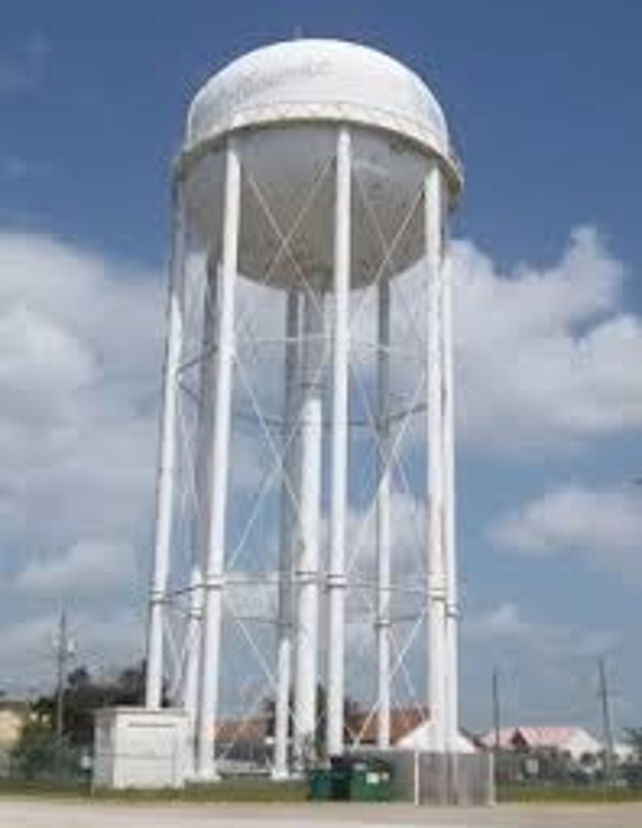 <p>a tower into which water is pumped to a height sufficient to maintain a desired pressure for distribution to customers, or for firefighting</p>