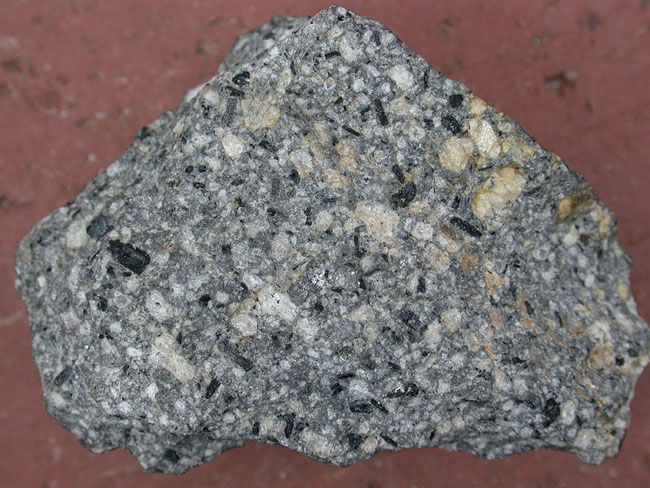 <p><strong>Mode of Cooling: Extrusive</strong></p><p><strong>Texture: Aphanetic</strong></p><p><strong>Mineral Composition: Intermediate</strong></p>
