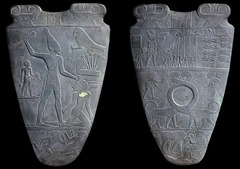 A stone slab with a circular depression, used to prepare eye makeup in Ancient Egypt