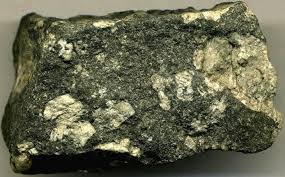 <p>Base of black, porphyritic because of the presence of larger crystals imbedded in smaller ones. Mafic composition</p>