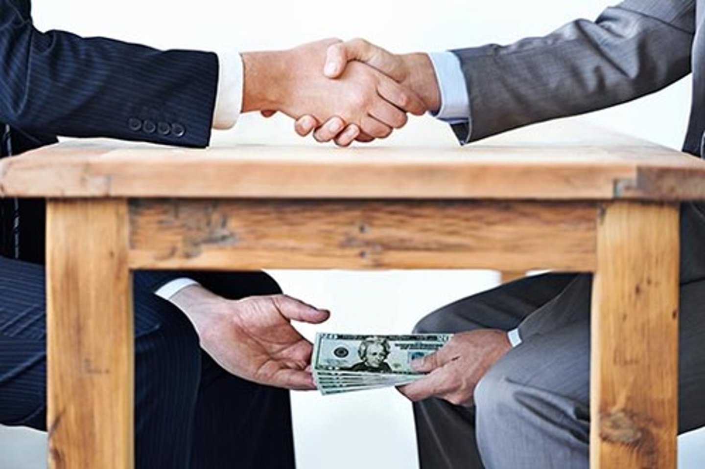 <p>to accept money or gifts in exchange for doing something dishonest or illegal (negative)</p><p>The politician was accused of ~ from large companies.</p><p>Several police officers lost their jobs after they were caught ~.</p>