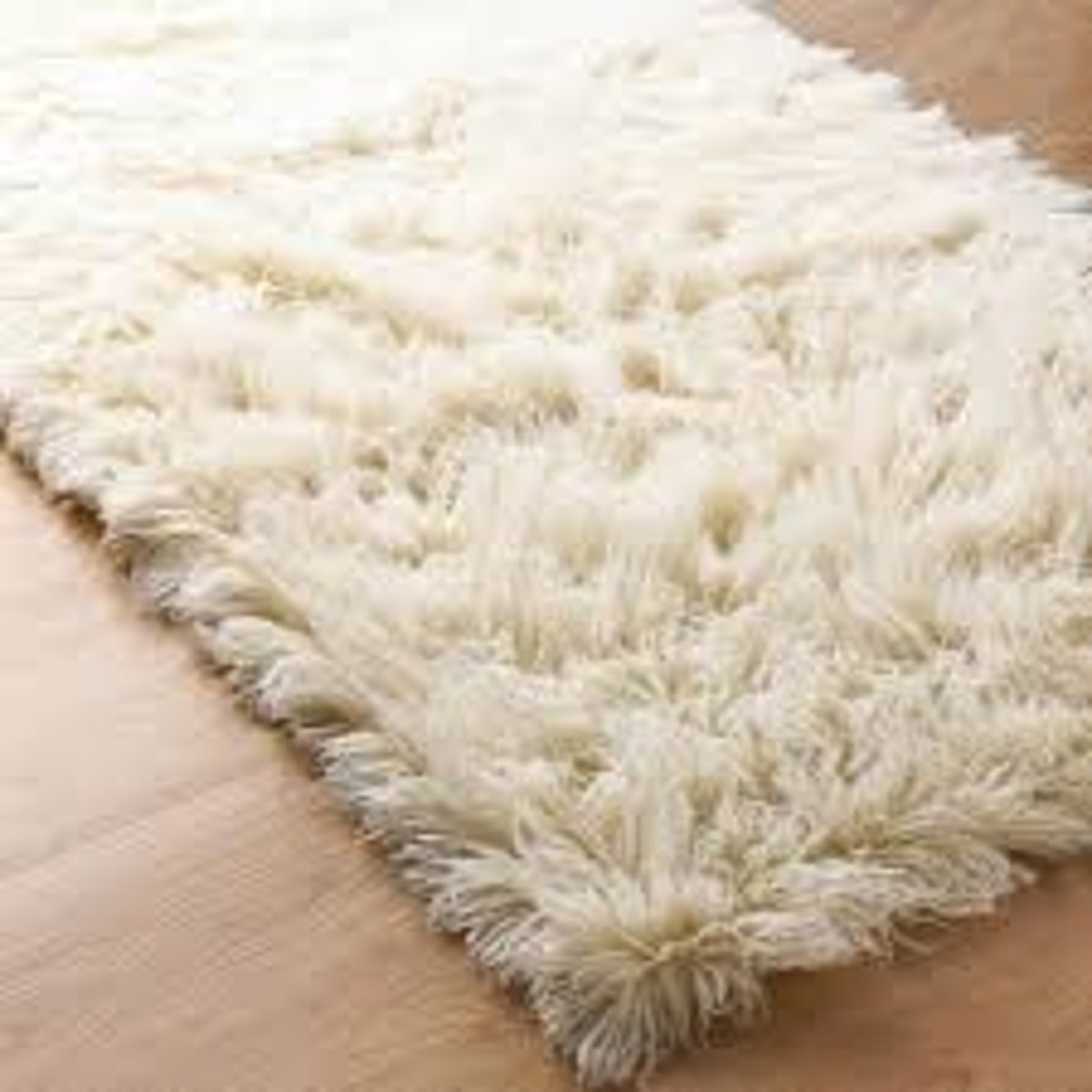 <p>Shaggy wool area rugs made in Greece, in solid colors as well as natural off white shade.</p>