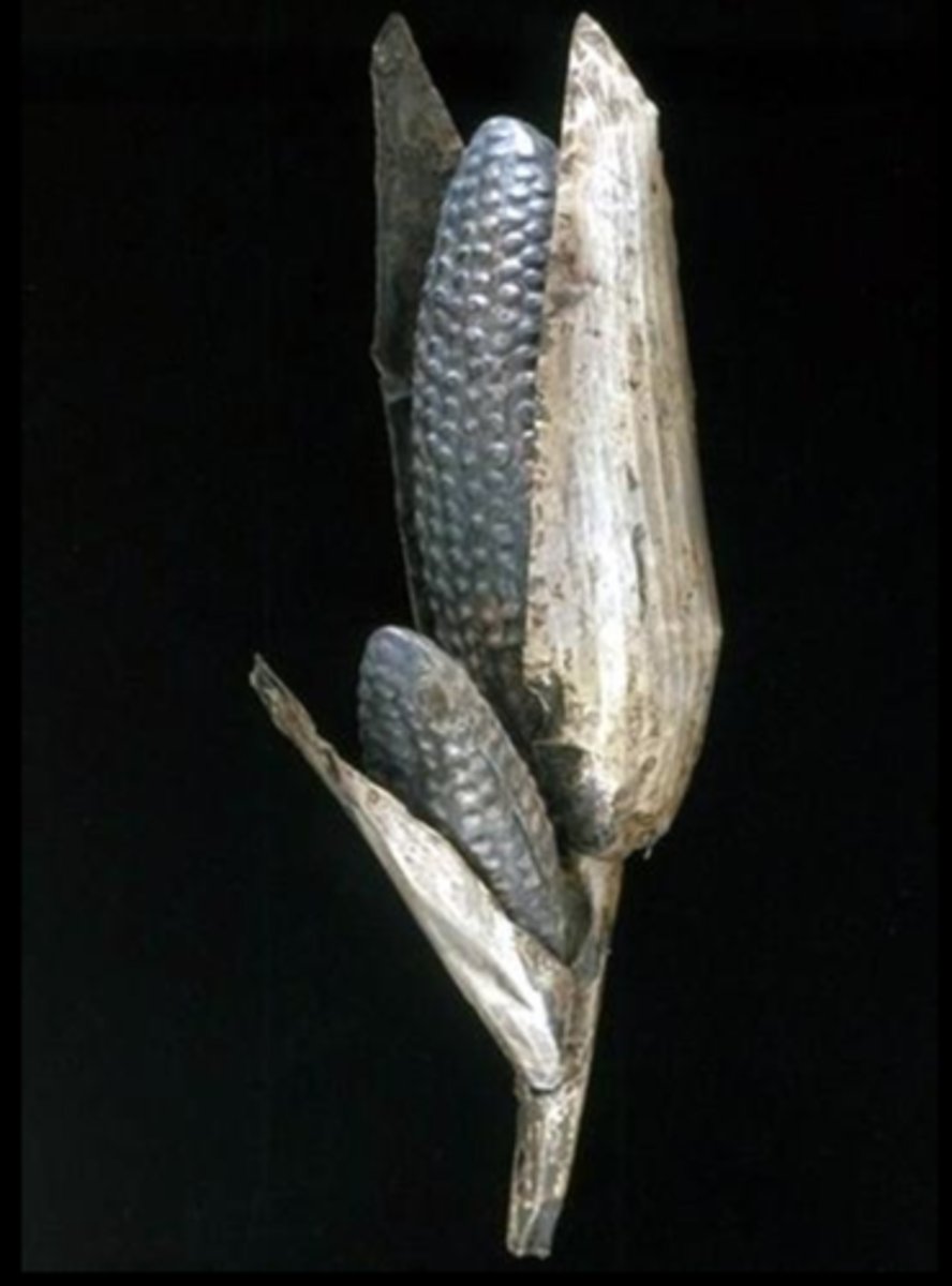 <p>Form- Made of thin sheets of metal. Repousse-Pressing detail into metal with sharp tools. Veins in corn shucks, kernels on cobs. Silver alloy. Life sized 10"-12"<br><br>Function- Possible used in ritual, in Cuzco garden<br><br>Content- Maize is most important crop for Incas. Metal (especially gold) was valued for its reflective quality, similar to the sun.<br><br>Context- Metallurgy is common to region. Found in Qorikancha, garden completely made of silver and gold with miniture llamas and people made of metal.</p>