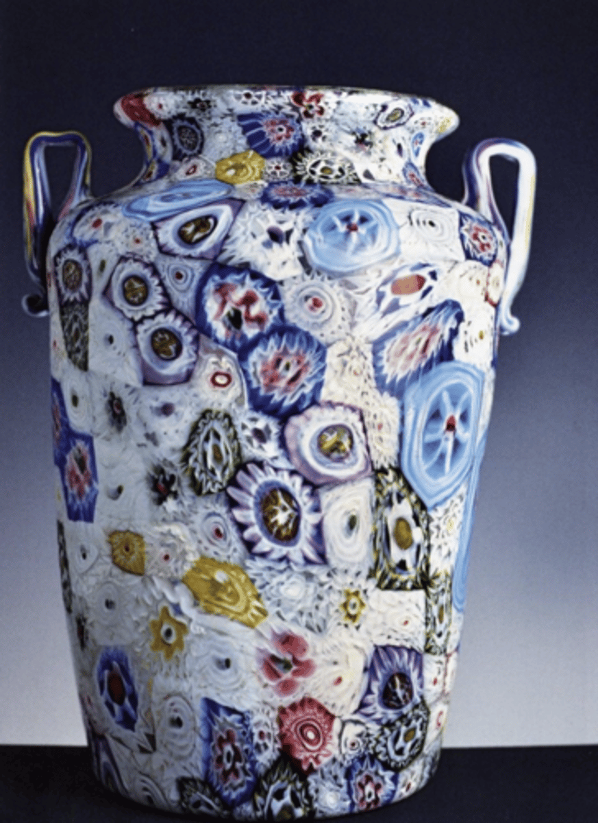 <p>Fragile opalescent glassware made by the romans and used for ornamental and useful purposes; imbedded with semiprecious stones</p>