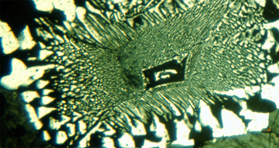 <p>subvolcanic rock (intrusive igneous that cooled at a shallow depth) made of quartz and alkali feldspar in angular intergrowths; basically granite with a finer texture and smaller grain size</p>