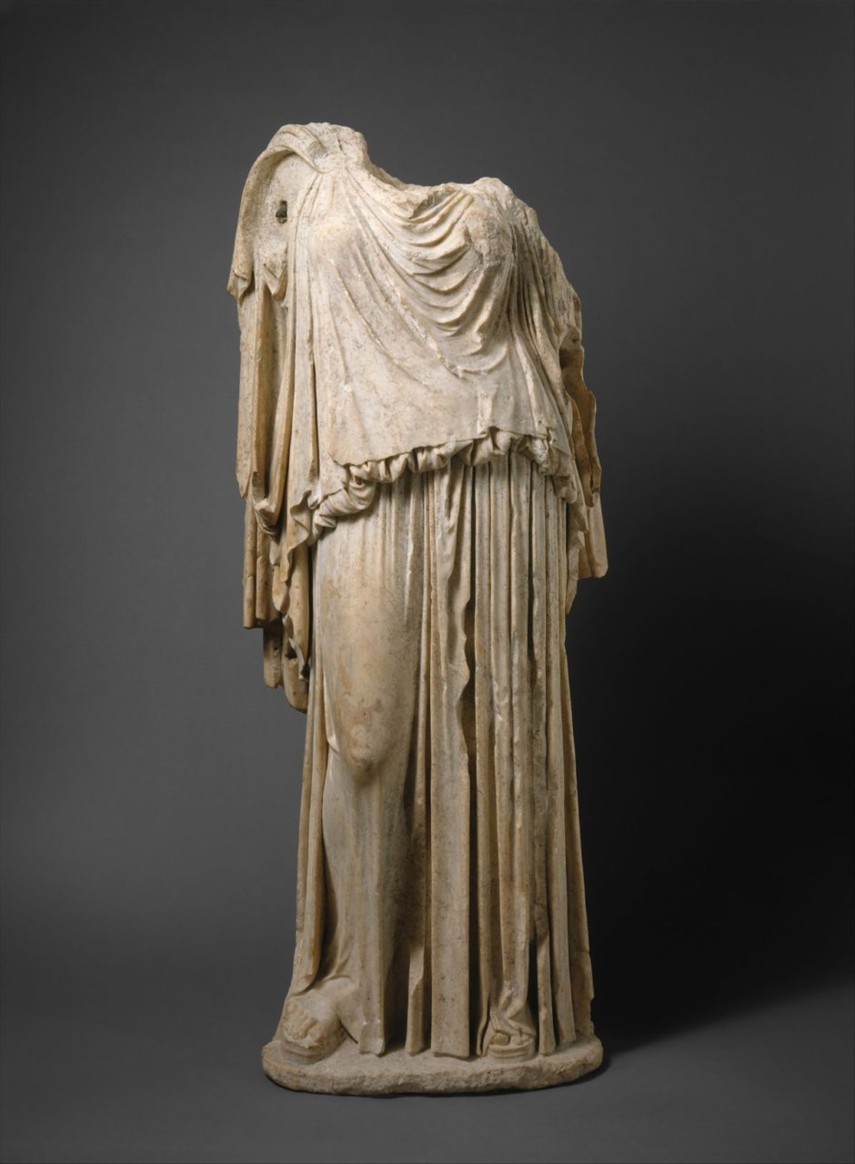 <p><span style="background-color: transparent;">worn during the archaic period, is represented as closely fitted, with an over fold at the top edge, probably made of wool, simple and vaguley doric column shape, fibula</span></p>