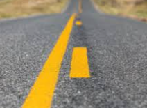 <p>next to your driving lane</p>