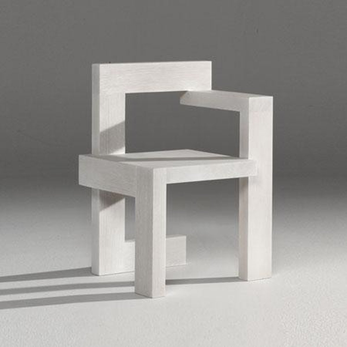 <p>Rietveld<br>oak<br>Chair with each leg directionally different.<br>axis (x,y,z) shifts give feeling of rotation</p>
