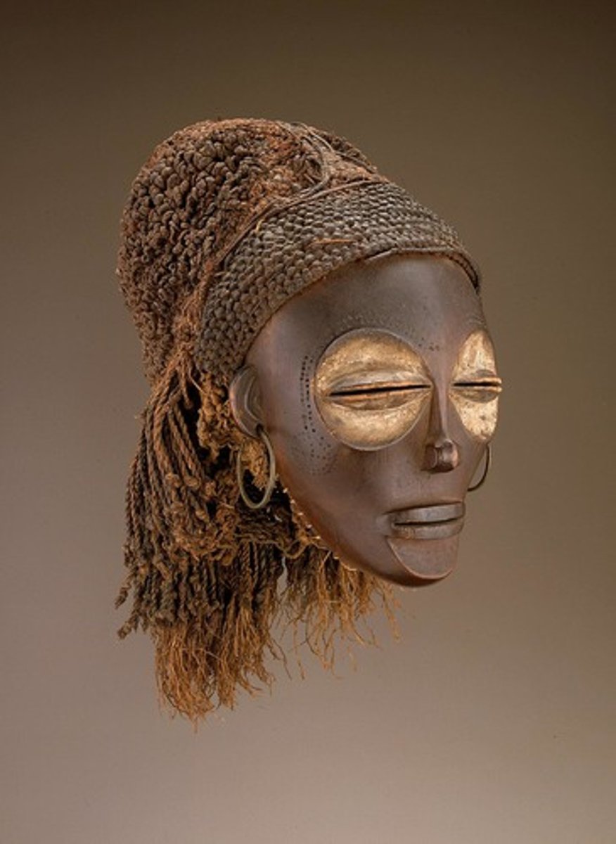 <p>CHOWKE PEOPLES, Wood, riber, pigment, metal)<br><br>Worn by men, who look and move by women. Meant to honor female ancestors (MATERNAL SOCIETY) and mothers :) <br>ENLARGED EYE SOCETS, SLENDER NOSES, CLOSED EYES!!! <br>Wisdom, spirituality, modesty!!<br>Marks underneath=tears (INITIATION?)<br>Ideal beauutttyyy!!<br>MASK may be discarded when not being used!!!!!!!!!</p>