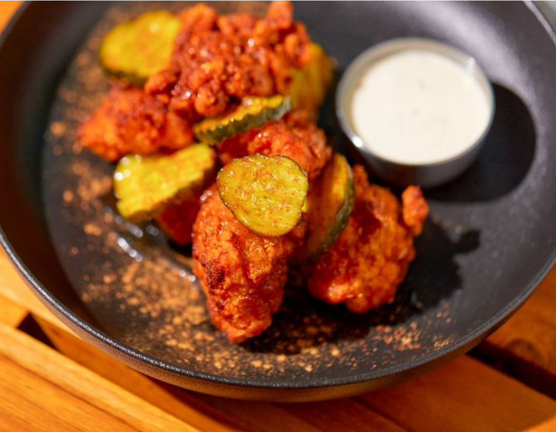 <p>This starter is spicy, crunchy, and slightly sweet! </p><p><span>Crispy fried chicken, Nashville spice, Honey, Creamy Parmesan Dip, Pickle Rounds</span></p>