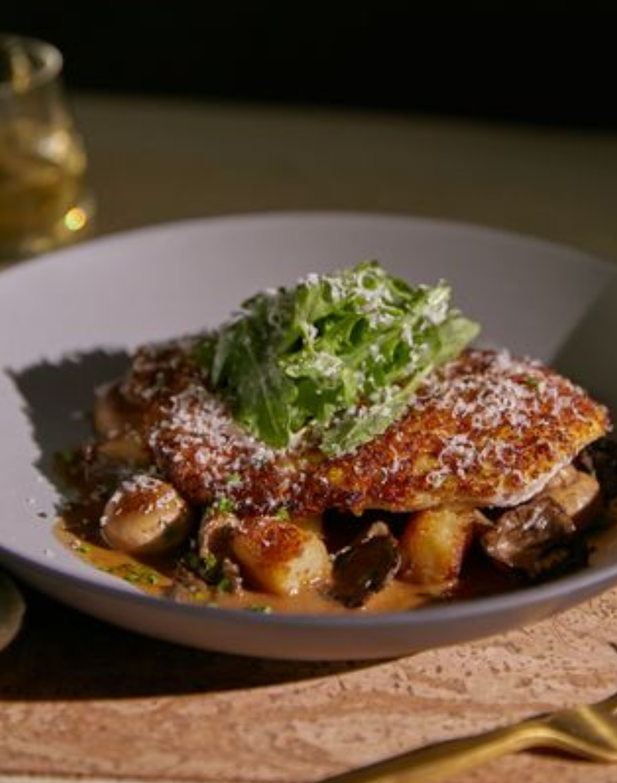 <p><em>Parmesan crusted chicken, pan-seared gnocchi, and creamy truffle mushroom sauce. These ingredients combine perfectly to result in an earthy, flavourful, and sure-to-be guest favourite dish.</em></p><p><em>Preset: steak knife </em></p><p><em>Ingredients: </em></p><ul><li><p>parmesan crusted chicken breast</p></li><li><p>roasted and grilled mushrooms</p></li><li><p>truffle mushroom cream sauce</p></li><li><p>potato gnochii</p></li><li><p>lemon juice</p></li><li><p>grana padano</p></li><li><p>arugula </p></li><li><p>cgu</p></li></ul><p></p>