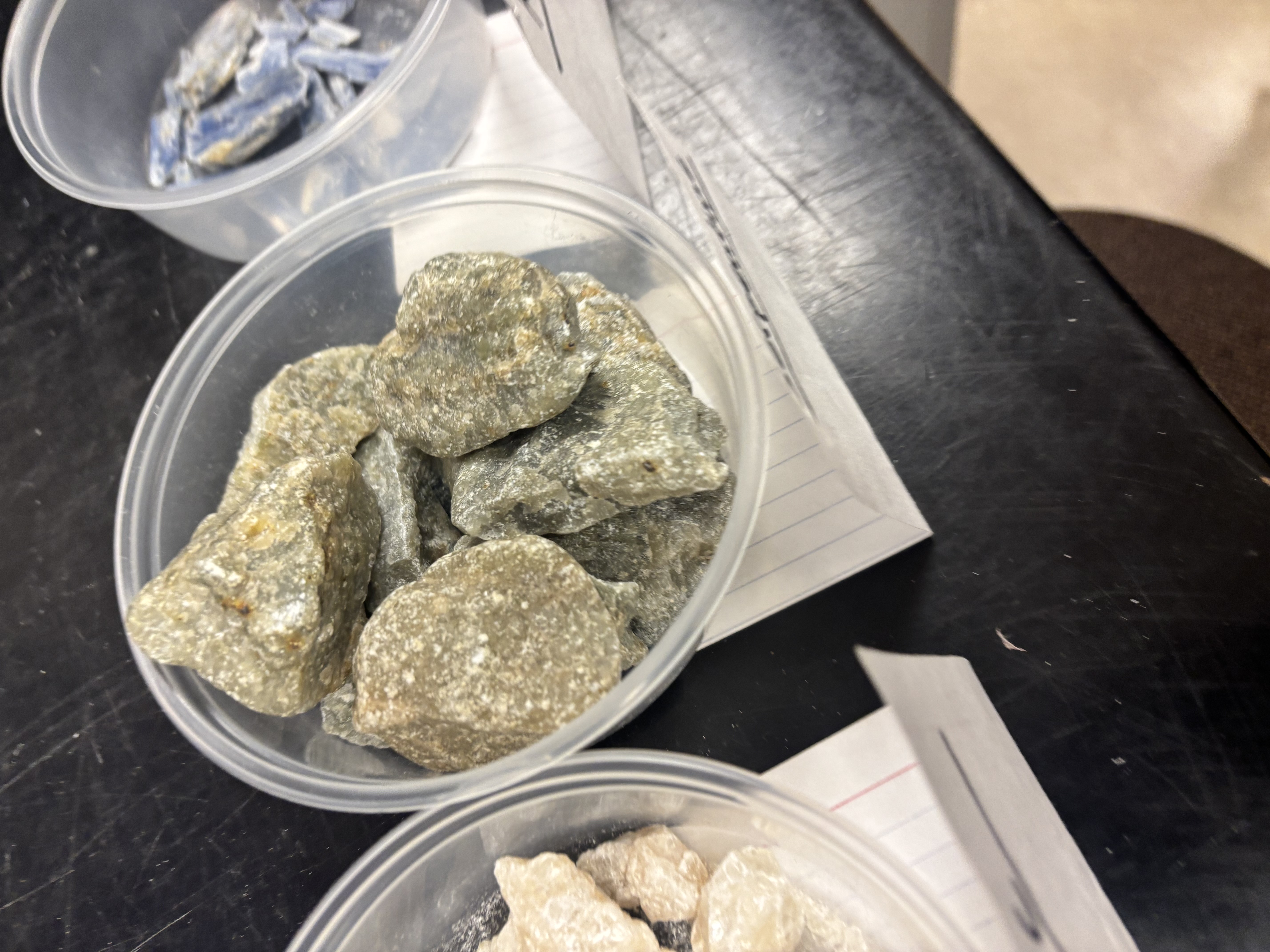 <p>Green, waxy mineral; forms by hydration of olivine in ultramafic rocks; component of serpentinite.</p>