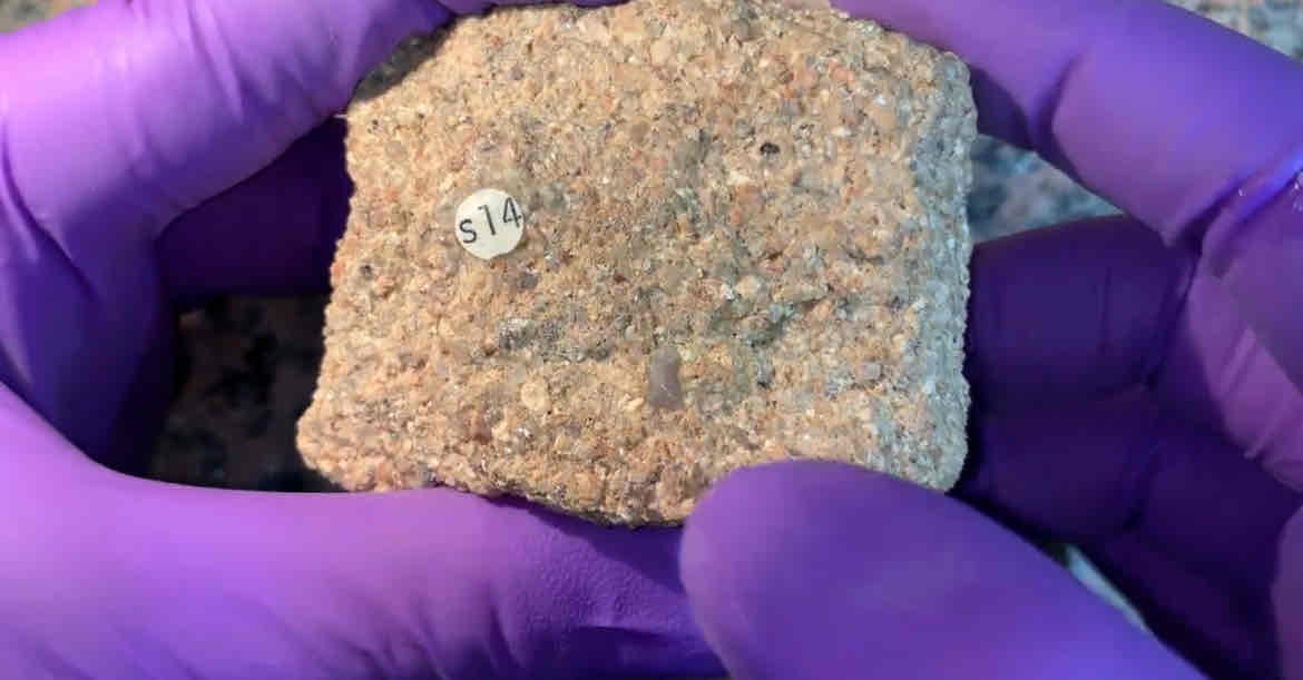 <p>what is this rock add heat and pressure</p><p>hint : angular pink crystals w cleavage not gravel quartz</p>