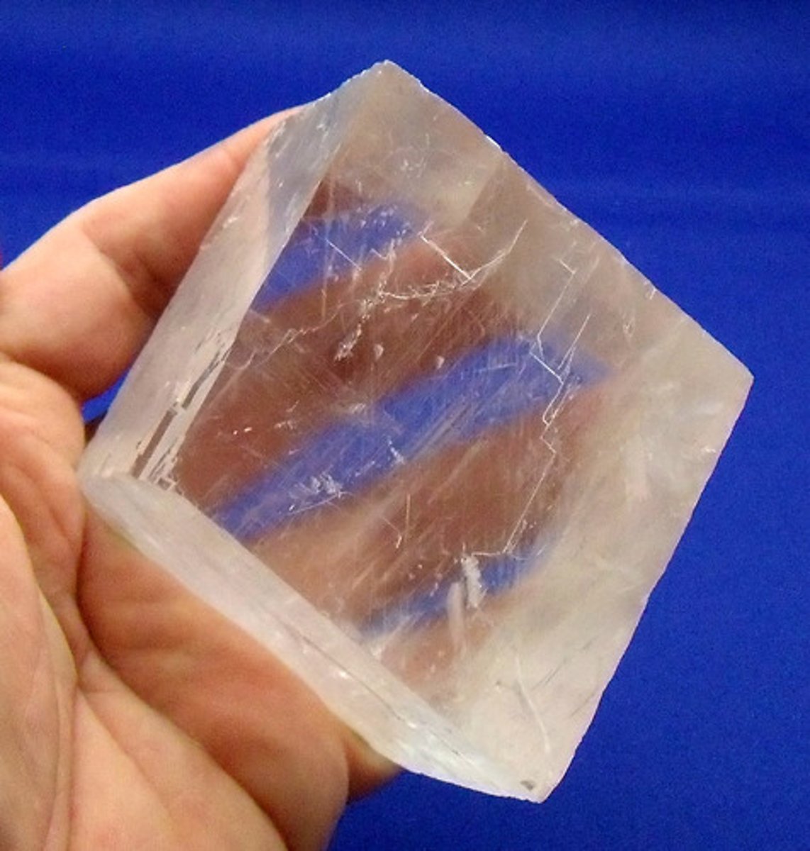<p>the tendency of a mineral to split along planes of its crystalline structure where bonds are weakest; some minerals break only in one direction, others break in two or more directions</p>