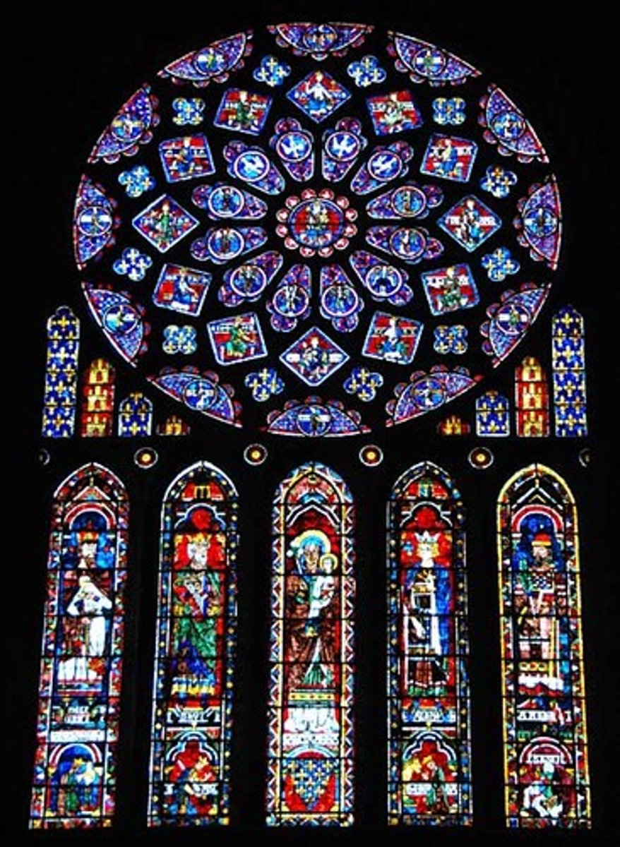 <p>a circular window composed of patterned tracery arranged in petal-like formation</p>