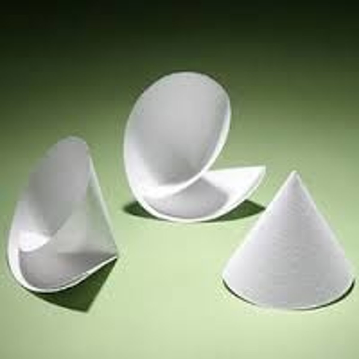 <p>special paper used to separate solids from liquids; usually round then folded in half and in half again and placed inside a funnel</p>