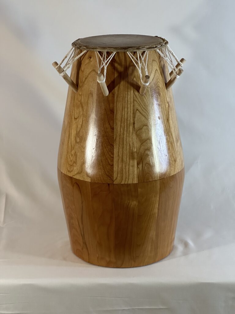 <p>medium sized drum often with markings/carvings. guides the tempo in ewe drumming ensembles</p>