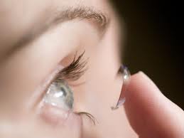 the transparent structure behind the pupil that changes shape to help focus images on the retina.