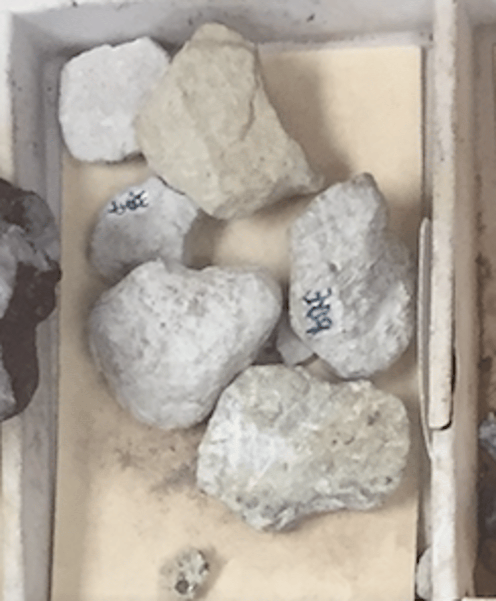 <p>Orthorhombic.<br>Bladed, foliated, massive, disseminated.<br>H = 6.5-7<br>SG = 3..35-3.45<br>Transparent to translucent. <br>Vitreous and pearly (cleavage face) luster.<br>Color = white, gray, yellowish, greenish.<br>Associated with corundum, dolomite, and chlorite schist.</p>