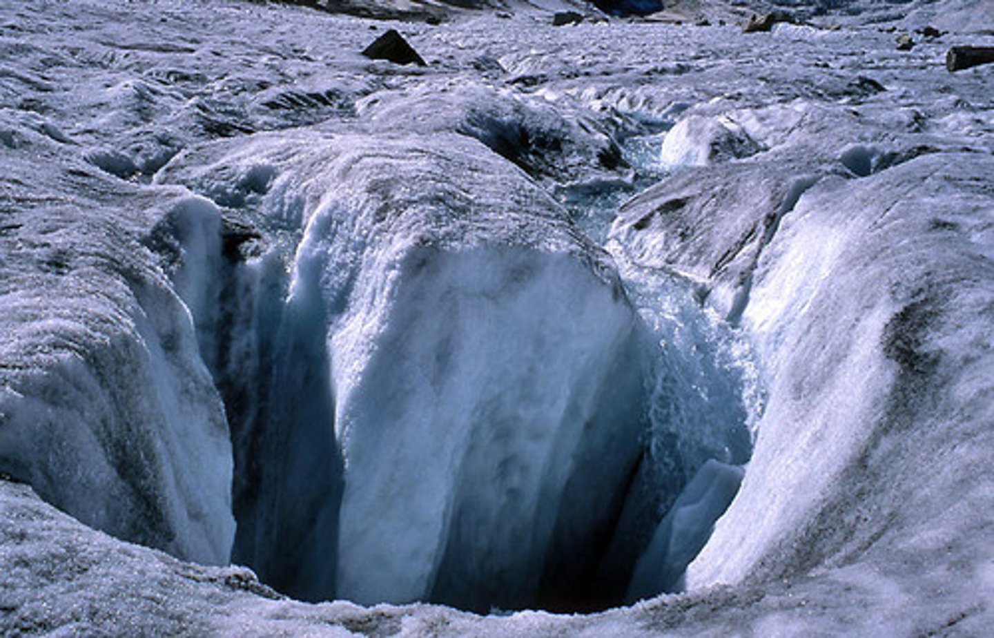 <p>A cylindrical, vertical shaft that extends through a glacier and is carved by meltwater from the glacier's surface.</p>