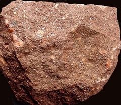 Composition: Rock Fragments or mineral grains
Type: Detrital; Gravel, round
Sorting: Moderate