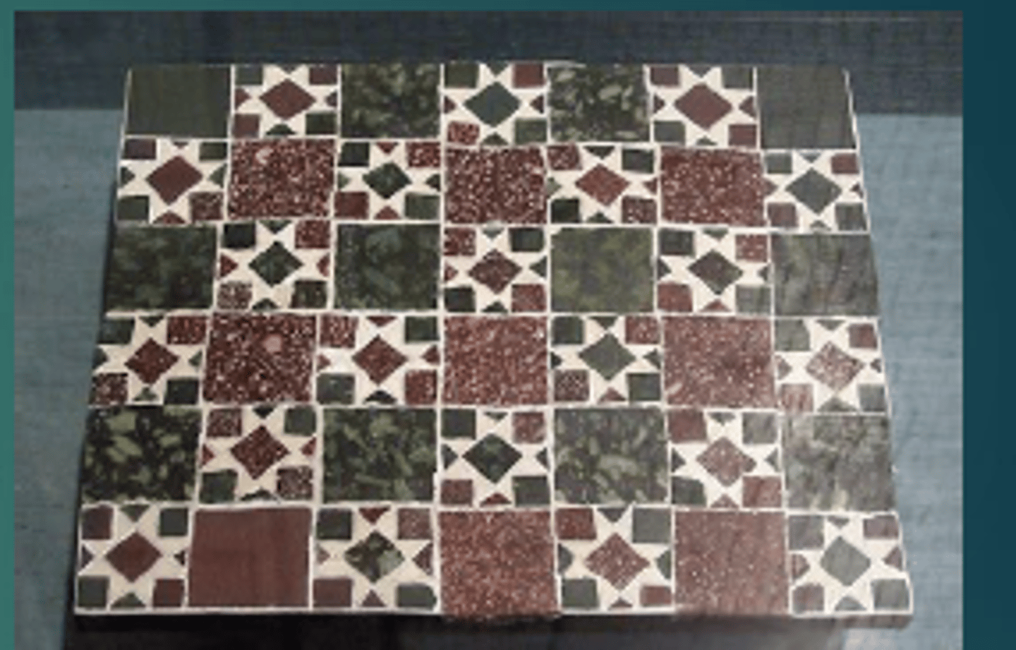 <p>A form of opus sectile having a geometric pattern formed with few colors, such as black and white, or dark green and red</p>