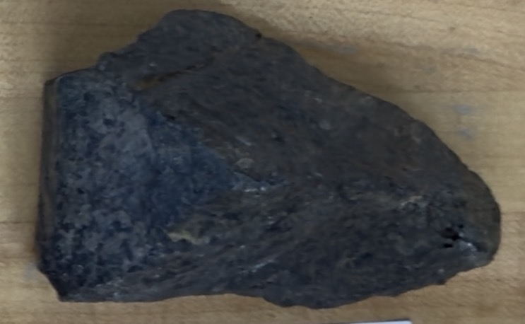 <p>Dark grey/black, angled 90 degrees, opaque</p>