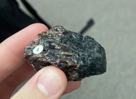 <p>Little Red crystals in rough black rock, <strong>Jewelry and abrasives</strong></p>