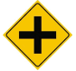 <p>This yellow sign means:</p><ul><li><p>Medical services ahead</p></li><li><p>There is a “T” intersection ahead</p></li><li><p>Another road crosses yours ahead</p></li></ul>