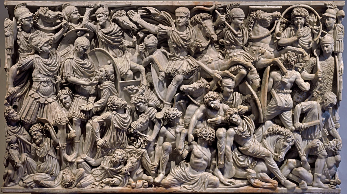 <ul><li><p><u><strong>Form</strong></u></p><ul><li><p>Extremely crowded surface with figures piled atop one another; horror vacui.</p></li><li><p>Abandonment of classical tradition in favor of a more animated and crowded space.</p><ul><li><p><strong>Horror vacui</strong>: (Latin for a “fear of empty spaces”) a type of artwork in which the entire surface is filled with objects, people, designs, and ornaments in a crowded, sometimes congested way</p></li></ul></li><li><p>Figures lack individuality.</p></li></ul></li><li><p><u><strong>Function</strong></u>: Interment of the dead; rich carving suggests a wealthy patron with a military background.</p></li><li><p><u><strong>Technique</strong></u></p><ul><li><p>Very deep relief with layers of figures.</p></li><li><p>Complexity of composition with deeply carved undercutting.</p></li></ul></li><li><p><u><strong>Content</strong></u></p><ul><li><p>Roman army trounces bearded and defeated barbarians.</p></li><li><p>Romans appear noble and heroic while the Goths are ugly.</p></li><li><p>Romans battling “barbaric” Goths in the Late Imperial period.</p></li><li><p>Youthful Roman general appears center top with no weapons, the only Roman with no helmet, indicating that he is invincible and needs no protection; he controls a wild horse with a simple gesture.</p></li></ul></li><li><p><u><strong>Context</strong></u></p><ul><li><p>Confusion of battle is suggested by congested composition.</p></li><li><p>Rome at war throughout the third century.</p></li><li><p></p></li></ul></li></ul>