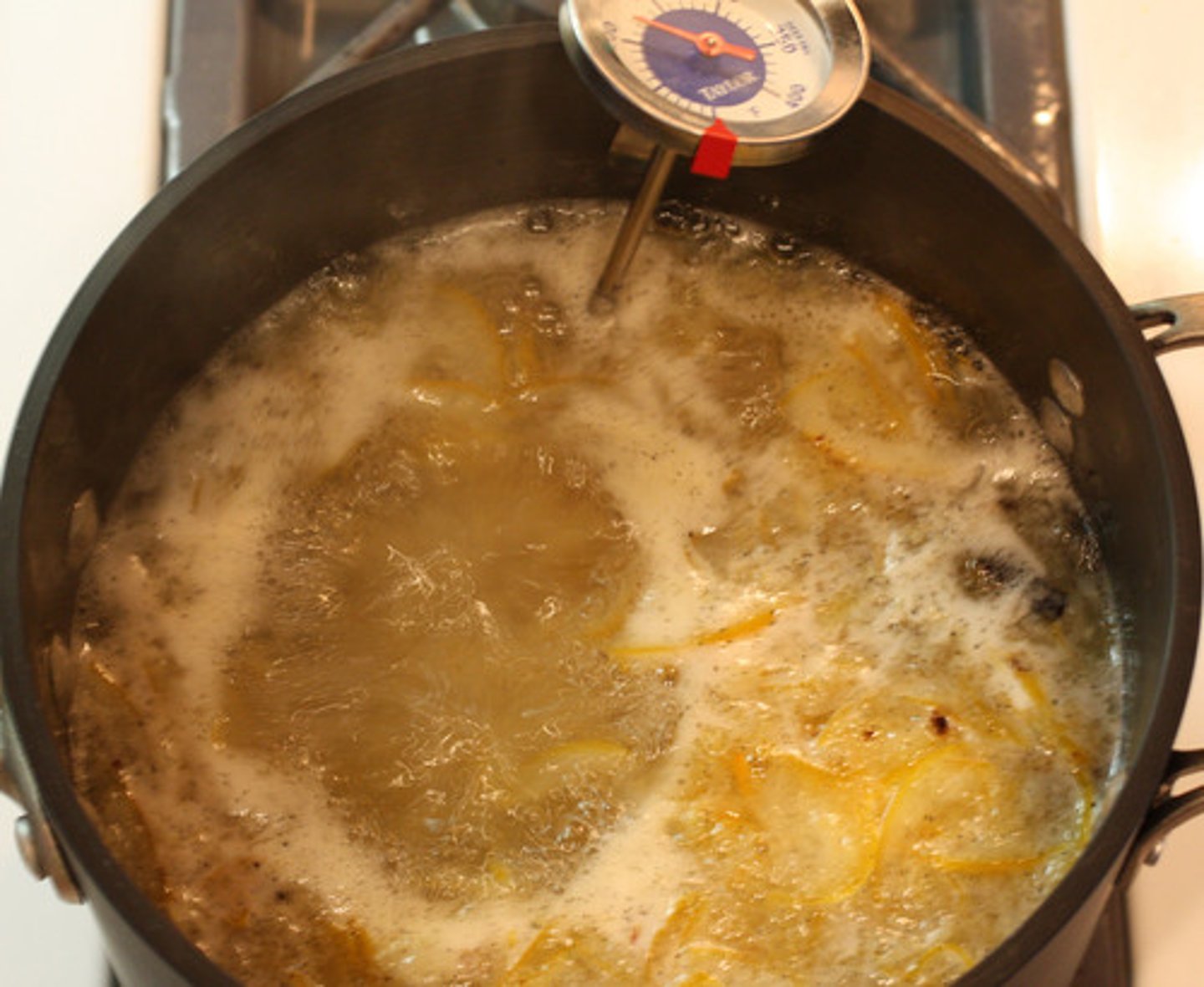 <p>To cook gently in a liquid just at or below the boiling point</p>