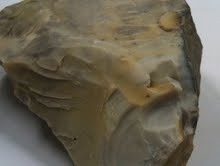 Luster: non-metallic
Hardness: 7 
Breakage: conchoidal fracture
streak: no streak
Color: light grey