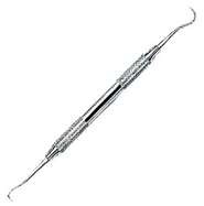 sharp blade in the shape of a sickle; used to remove calculus and elastic separators from tooth surfaces