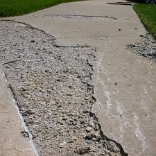<p>deterioration of the upper concrete slab surface</p>