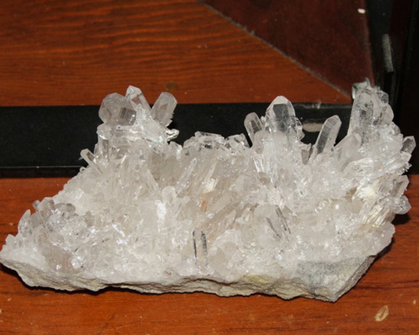 <p>Mineral</p><p>Color: several possible, often white, clear, or pink</p><p>Streak: colorless or light colored</p><p>Layers:</p><p>Texture: smooth</p><p>Shiny: glassy luster in crystal form</p><p>Hardness: Moh's scale 7</p><p>Other: hexagonal shape fracture (crystals)</p><p>specific gravity: 2.65</p>
