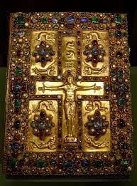 <ul><li><p>c. 800, Court School of Charles the bold, 350 x 275mm, possibly made in the Royal Abbey of St, Denis, Carolingian Art.  Made of gold, emeralds, and rubies.</p></li><li><p>Created during an attempt to reestablish the Roman Empire under Charlemagne. Contains the gospels along with other information.</p></li><li><p>Shows the crucifixion of Christ not suffering other than the blood dripping from his hand. He is robed like that of Roman classical art.</p></li><li><p>The cross is made of small arches representing the architecture of the later Basilicas. Christ is surrounded by mourners.</p></li></ul>