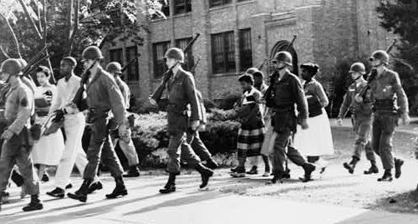 <p>Governor Faubus sent Arkansas National Guard troops to prevent nine African American students from entering Little Rock Central High School. Eisenhower sent in U.S. paratroopers to ensure the students could attend class.</p>