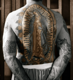 <p><strong><em><u>Context: </u></em></strong><span style="background-color: transparent;"><span>Juan Diego feels as though the catholic mother of god has spoken to him in his native tongue, relays his message to the Catholic bishop</span></span></p><ul><li><p><span style="background-color: transparent;"><span>Goes back to the bishop and shows him his cloak</span></span></p></li></ul><ul><li><p><span style="background-color: transparent;"><span>Juan Diego becomes the first saint in the Mexican Catholic Church</span></span></p></li></ul><p><span style="background-color: transparent;"><span>However this image began, it has countless manifestations in numerous forms of media</span></span></p><ul><li><p><span style="background-color: transparent;"><span>One of the most common ways in which prisoners in Mexico have themselves tattooed is with the image of guadalupe o their back</span></span></p><ul><li><p><span style="background-color: transparent;"><span>This image of divinity is on their spine</span></span></p><ul><li><p><span style="background-color: transparent;"><span>The spine carries our nervous system, literally holds us up, holding up these men who are living extremely difficult lives</span></span></p></li></ul></li></ul></li></ul><p><span style="background-color: transparent;"><span>These gradiations of divine imagery are radiating from their back, so when they move, the Virgin of Guadalupe is moving with them → a </span><strong><span>genius form of prison art</span></strong></span></p>