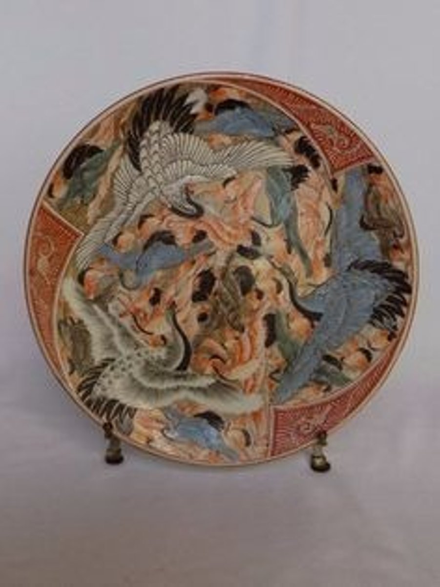 <p>Japanese vessels that were grayish in color because of impurities in the clay. Known for its <span class="bgY">bold and imaginative</span> designs, which frequently utilize a <span class="bgY">special range of colors</span> in overglaze enamels.</p>