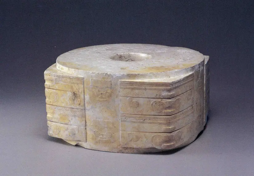 <p>stone tube and disc laid on chest to protect deceased in afterlife</p>