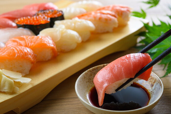 <p>(noun phrase) <em>a strong-tasting, dark brown liquid made from soy beans and used especially in Chinese and Japanese cooking</em></p><p>“I like to dip my sushi in _______.”</p>