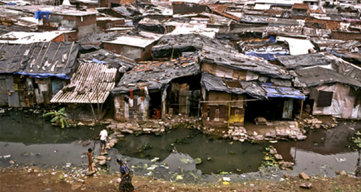 <p>A heavily populated urban area characterized by substandard housing and squalor.</p>