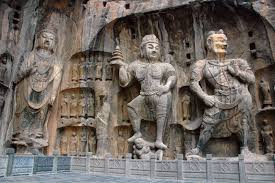 <p>“Longmen Caves” Tang Dynasty; China; 7th cent.</p><p>CONTEXT:</p><ul><li><p>Yi River - trade; ppl. (travelers) are going to see it</p></li><li><p>Emperor Gaozong adopts foreign religion (buddhism) to unify newly amalgamated (united) districts</p><ul><li><p>adopts foreign religion to avoid looking like a tyrant by forcing his own religion onto the people</p></li></ul></li><li><p>Confucius beliefs - clear ordering of the Buddhas</p></li></ul><p></p><p>VISUALS:</p><ul><li><p>Primordial Buddha - celestial buddha</p></li><li><p>Guardian figures - ward off evil spirits w/ open hand</p></li><li><p>combines Buddhist, warriors, and court official in relief → legitimizes rule</p></li></ul><p></p><p></p>