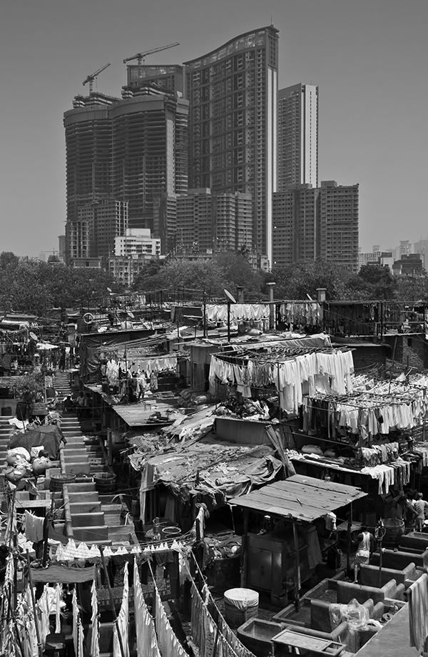 <p><span><span>As migrants from rural areas continue to move to cities for jobs, cities face a variety of economic and social challenges. Which of the following economic or social challenges is best illustrated by the photograph shown of Mumbai, India?</span></span></p>