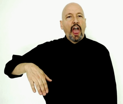 <p><span style="font-size: medium">The dominant hand moves backward a couple times swinging at the wrist. places the tongue over the bottom teeth, and uses a slight headshake.&nbsp;</span></p>